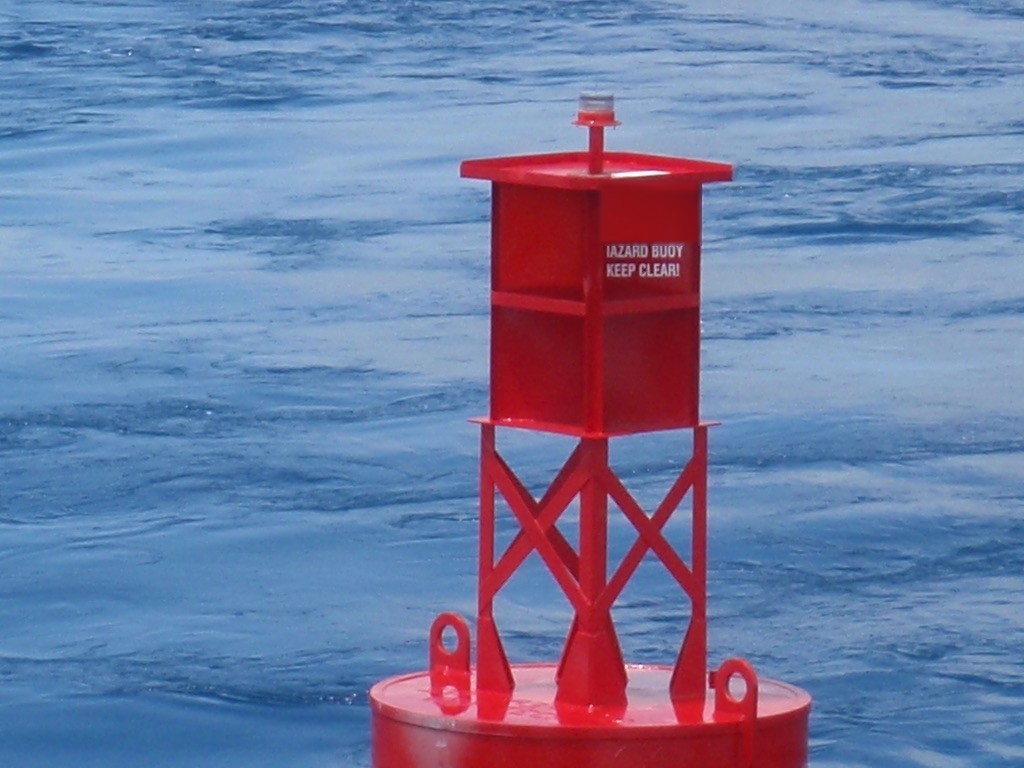 Red BL 620 steel lighted buoy on station offshore with welded tower, lantern and mooring eyes, built by Wet Tech Energy in Maurice, Louisiana