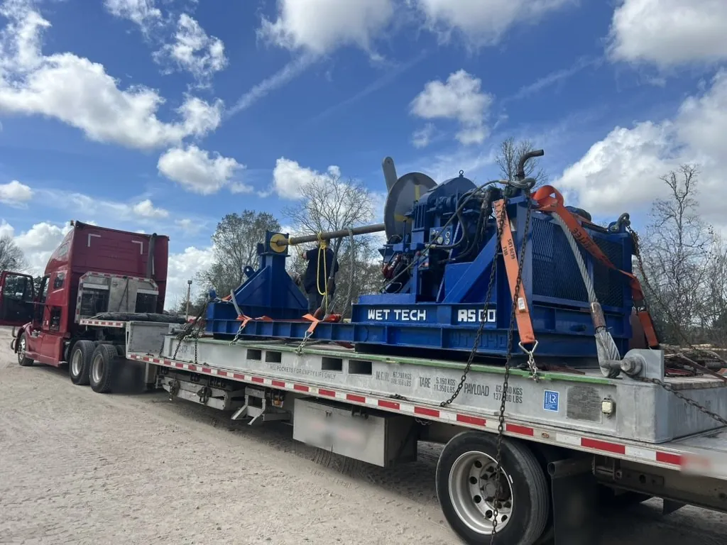 Wet Tech RS-001 spooling unit shipped on an offshore shipping flat rack.